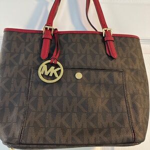 Michael Kors with red piping purse